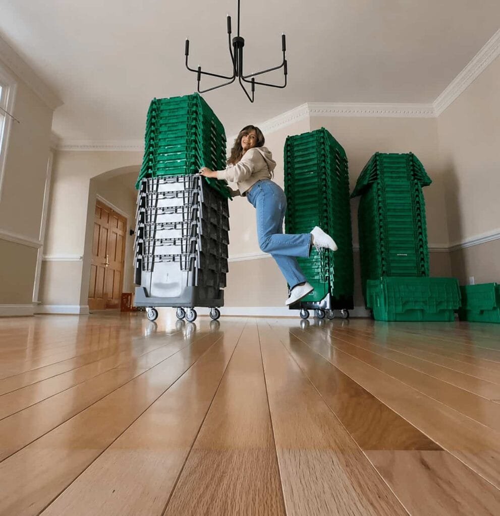 Home 12 Girl using bins for moving